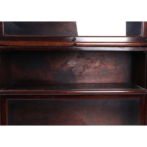 2066 - An early 20th century Globe Wernicke barrister's stacking bookcase with drawer plinth base, 87cms wi... 