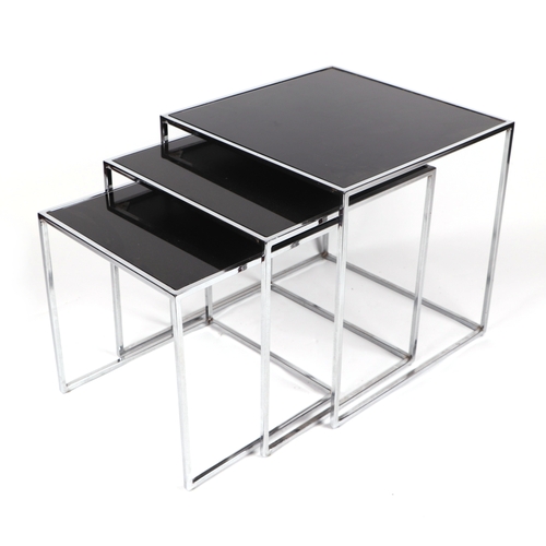 2079 - A modern design chrome and black glass nest of three tables, the largest 50cms wide.