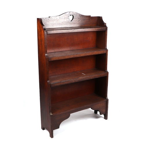 2028 - A Liberty style oak four-tier open bookcase, 74cms wide.