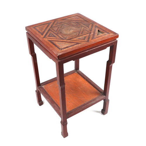 2031 - An Indian two-tier hardwood side table the top with a parquet design inlaid top, 43cms wide.