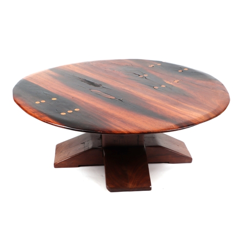 2050 - An African stinkwood coffee/occasional table, 90cm diameter.