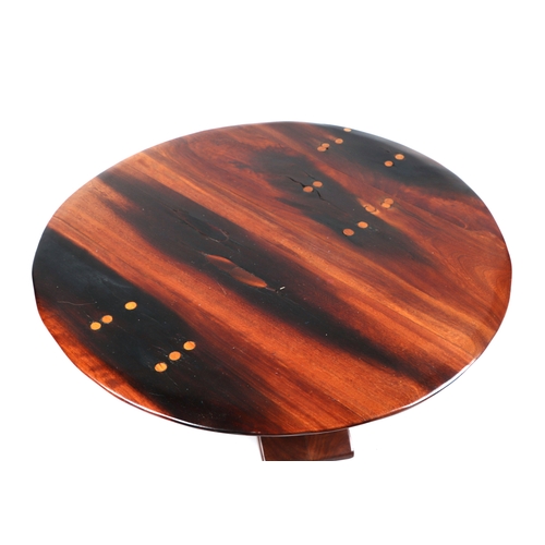 2050 - An African stinkwood coffee/occasional table, 90cm diameter.