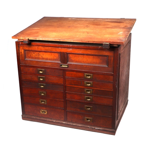 2065 - A 19th century pine and mahogany architect's desk, the sloped top above a lift-up door containing a ... 