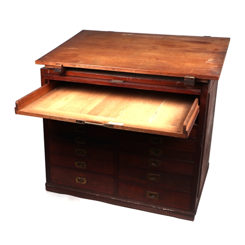 2065 - A 19th century pine and mahogany architect's desk, the sloped top above a lift-up door containing a ... 