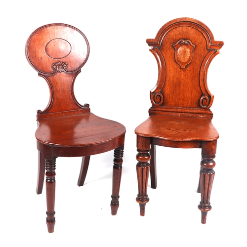 2070 - A 19th century mahogany hall chair with cartouche shaped back, solid seat and reeded front legs; tog... 