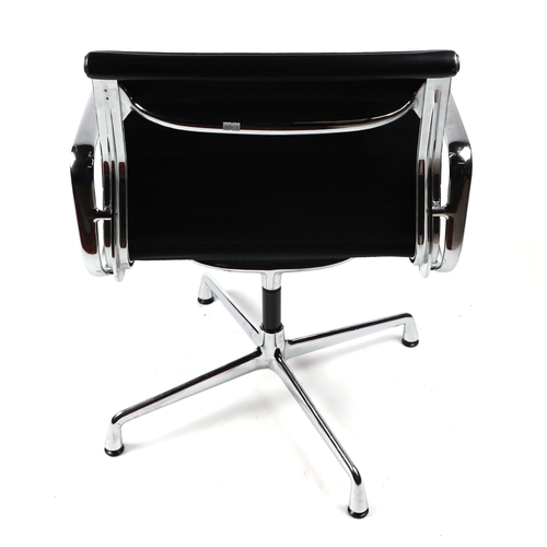 2072 - A Vitra Charles and Ray Eames EA108 aluminium group leather armchair.