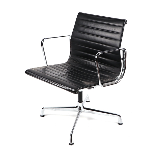 2073 - A Vitra Charles and Ray Eames EA108 aluminium group leather armchair.