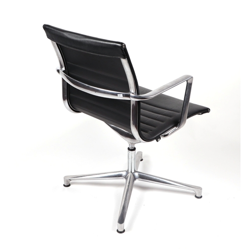 2074 - A Vitra Charles and Ray Eames EA108 aluminium group leather armchair.