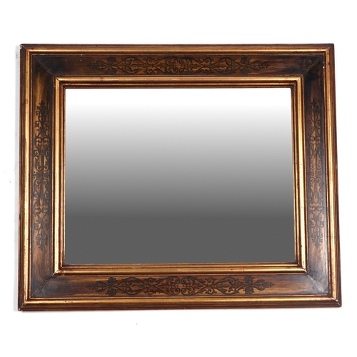 2007 - A gilt framed wall mirror with painted decoration, overall 50cm by 60cm.