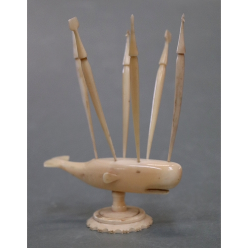 1569 - Folk Art:  A carved marine ivory sperm whale toothpick holder in the form of a whale mounted on a pl... 