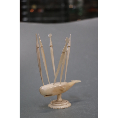 1569 - Folk Art:  A carved marine ivory sperm whale toothpick holder in the form of a whale mounted on a pl... 