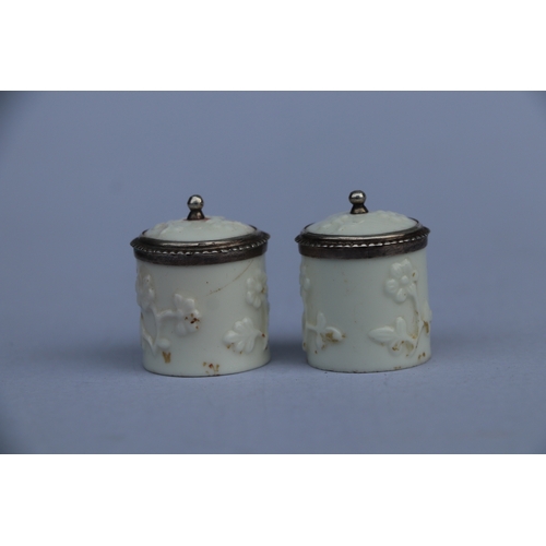 1397 - A pair of 18th century French Saint Cloud porcelain silver mounted miniature tobacco jars and covers... 