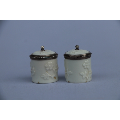 1397 - A pair of 18th century French Saint Cloud porcelain silver mounted miniature tobacco jars and covers... 