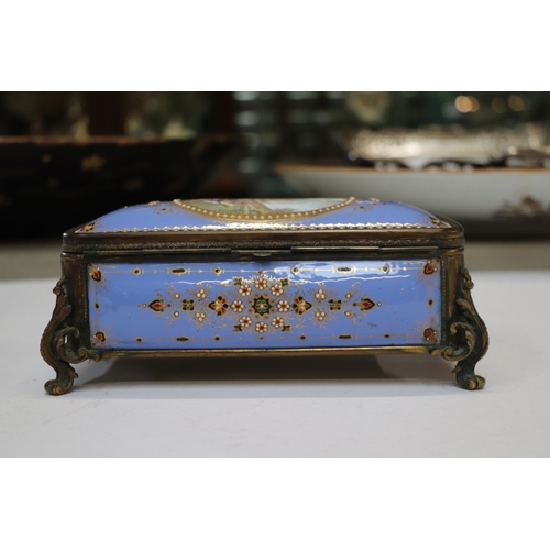 1574 - A 19th century French enamel and ormolu mounted trinket box with blue ground and jewelling, the top ... 