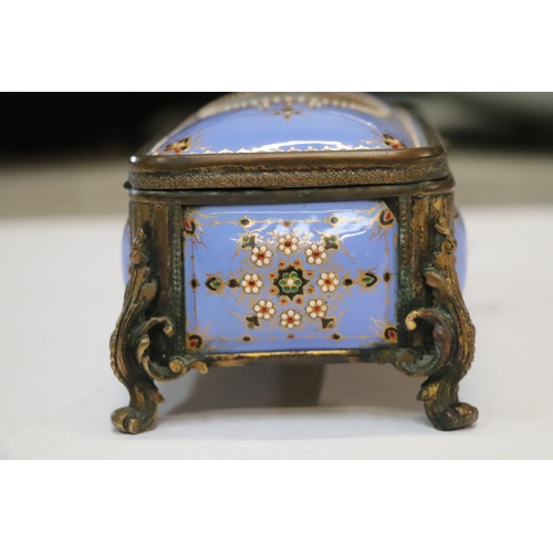 1574 - A 19th century French enamel and ormolu mounted trinket box with blue ground and jewelling, the top ... 