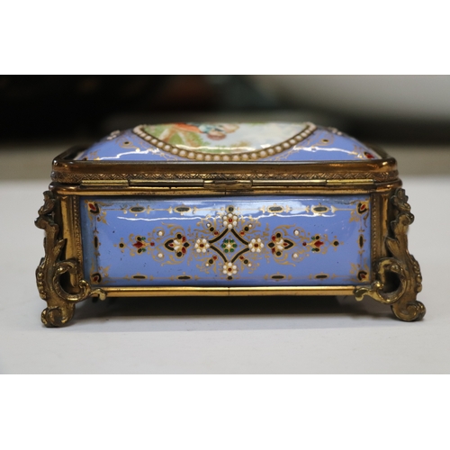 1575 - A 19th century French enamel and ormolu mounted trinket box with blue ground and jewelling, the top ... 