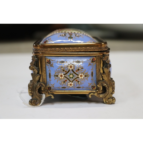 1575 - A 19th century French enamel and ormolu mounted trinket box with blue ground and jewelling, the top ... 