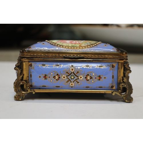 1575 - A 19th century French enamel and ormolu mounted trinket box with blue ground and jewelling, the top ... 