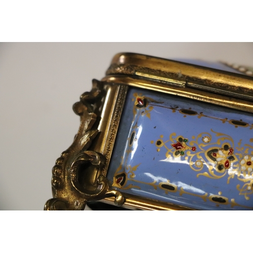 1575 - A 19th century French enamel and ormolu mounted trinket box with blue ground and jewelling, the top ... 