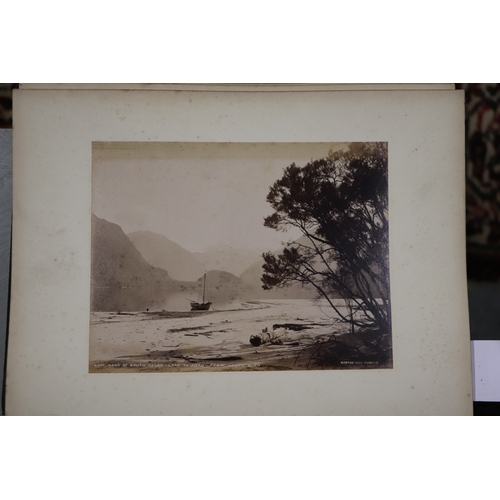 748 - A late Victorian albumen album containing images of New Zealand, sixty eight 20 by 15cms images, the... 