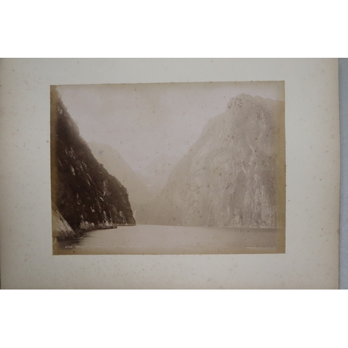 748 - A late Victorian albumen album containing images of New Zealand, sixty eight 20 by 15cms images, the... 