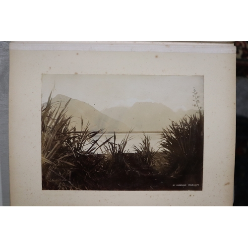 748 - A late Victorian albumen album containing images of New Zealand, sixty eight 20 by 15cms images, the... 