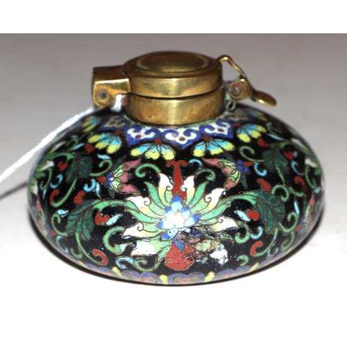 1961 - A Chinese cloisonné scholars inkwell, decorated flowers on a black ground, 9cm diameter