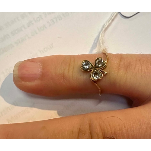 533 - An antique yellow metal (tests as gold) diamond set clover leaf shaped ring, approx UK size O, 2.3g.