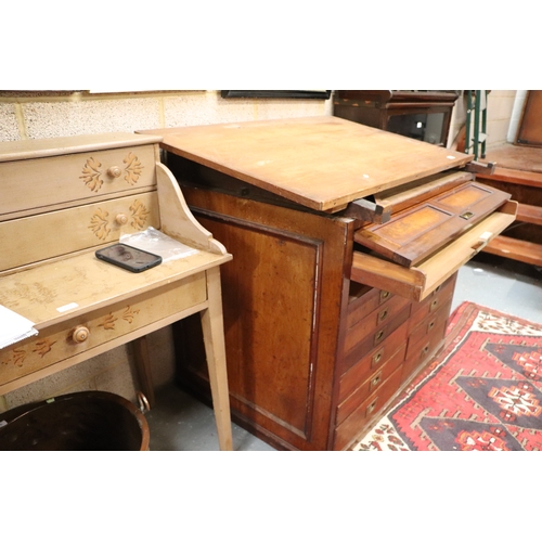 2065 - A 19th century pine and mahogany architect's desk, the sloped top above a lift-up door containing a ... 