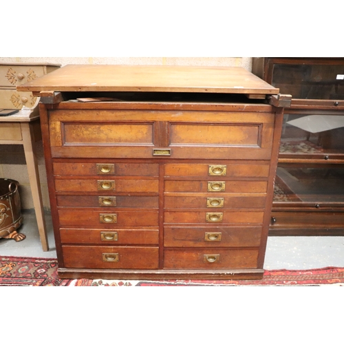 2065 - A 19th century pine and mahogany architect's desk, the sloped top above a lift-up door containing a ... 