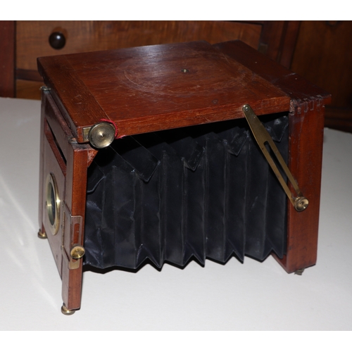 1491 - A late Victorian / Edwardian mahogany bellows plate camera by A Birnie, Dundee, with tripod stand, i... 