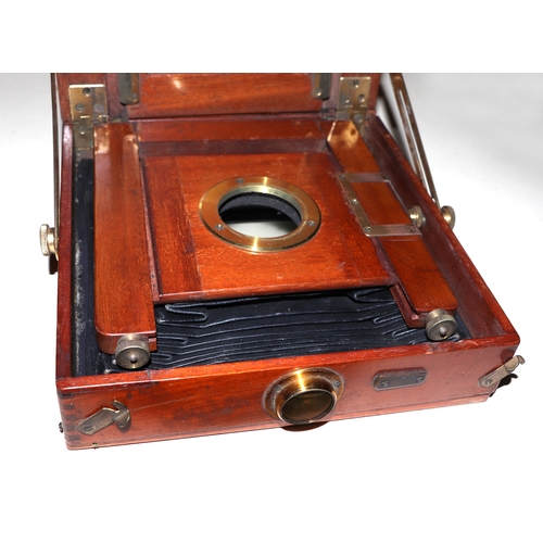 1491 - A late Victorian / Edwardian mahogany bellows plate camera by A Birnie, Dundee, with tripod stand, i... 