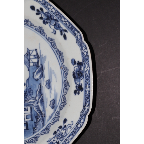 635 - A pair of 19th century Chinese blue & white plates of octagonal form decorated with a river landscap... 