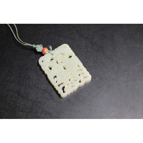 1982 - A Chinese pierced jade pendant, 5 by 6.5cms.