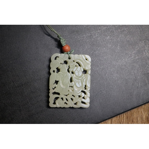 1982 - A Chinese pierced jade pendant, 5 by 6.5cms.