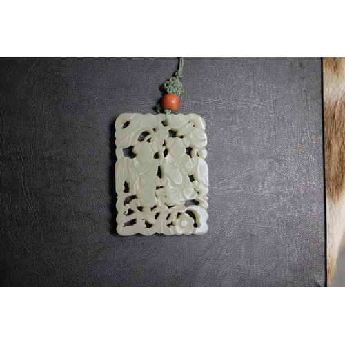 1982 - A Chinese pierced jade pendant, 5 by 6.5cms.