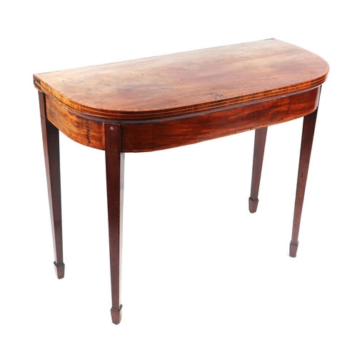 1009 - A 19th century mahogany card table on square tapering legs terminating in spade feet, 92cms wide.