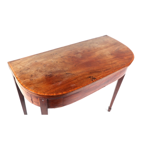 1009 - A 19th century mahogany card table on square tapering legs terminating in spade feet, 92cms wide.