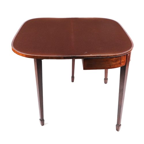 1009 - A 19th century mahogany card table on square tapering legs terminating in spade feet, 92cms wide.