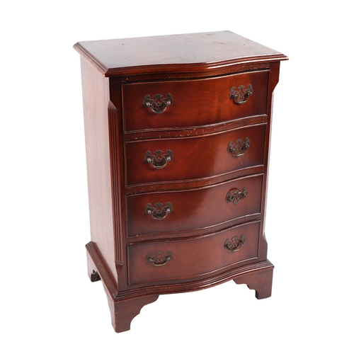 1016 - A Georgian style mahogany serpentine fronted chest of four long drawers, of small proportions, on br... 