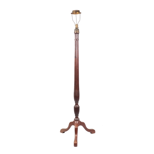 1017 - A mahogany standard lamp with reeded column on tripod base.