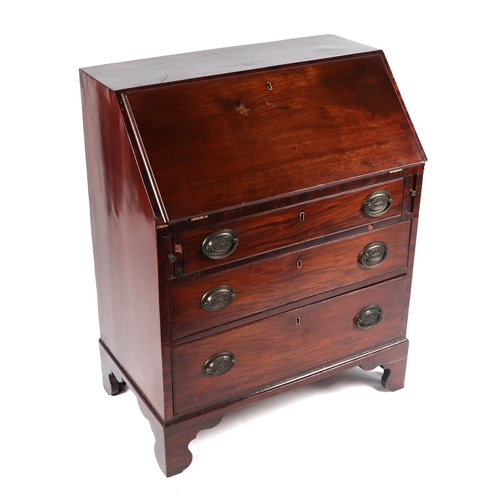 1019 - A Georgian mahogany bureau, the fall-front opening to reveal a fitted interior above three graduated... 