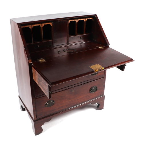 1019 - A Georgian mahogany bureau, the fall-front opening to reveal a fitted interior above three graduated... 