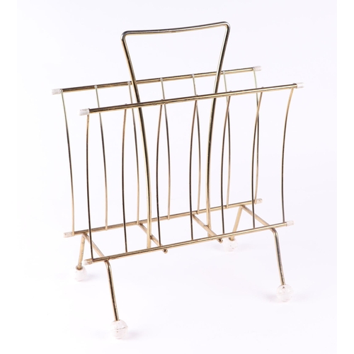 1023 - A mid 20th century Sputnik type two-division magazine rack, 34cms wide.