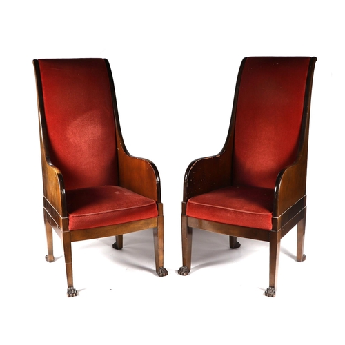 1025 - A pair of walnut high back throne type chairs with lion paw front feet (2).