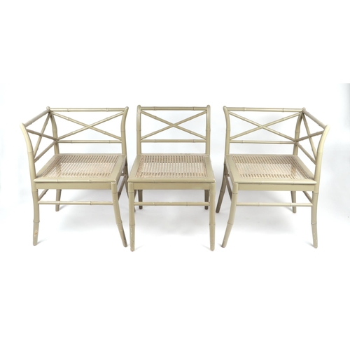 1029 - A Chippendale style painted faux bamboo three-piece suite comprising two corner chairs and a centre ... 