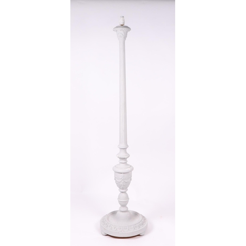 1041 - A distressed painted standard lamp with reeded column, on a circular base.