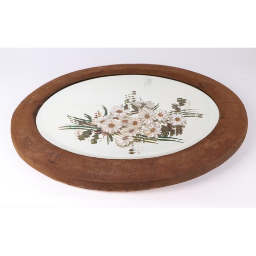 1070 - A Victorian oval wall mirror, the plate painted with flowers, in a fabric covered frame, 47 by 57cms... 