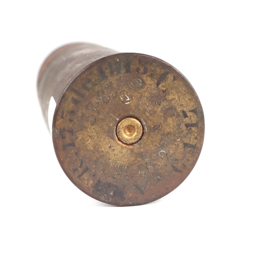 116 - A complete inert WWI artillery shell and brass casing. Date stamp to the base for 2. 16. (February 1... 