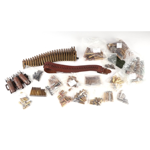 137 - A .22 leather cartridge belt, and assorted spent brass cartridge cases for various calibre weapons.